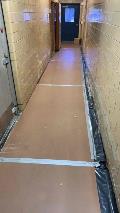 Corridor floor is protected. Demo has been completed.